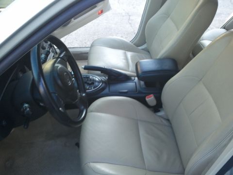 2008 Subaru Legacy - The interior of a car is shown, leather seats and the steering wheel.