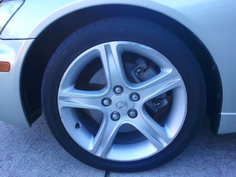 2008 Subaru Legacy - A close-up shot focuses on the wheel and tire of a Lexus, with a watermark at the bottom.
