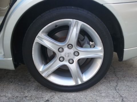 2008 Subaru Legacy - Close-up of a car's wheel, showing the alloy design and tire tread.