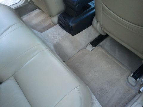 2008 Subaru Legacy - Interior view of a car's back seat and floor mats, with a visible center console.