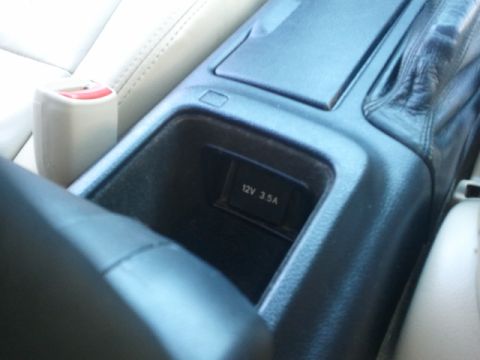 2008 Subaru Legacy - Interior shot of a car's center console, highlighting the 12V power outlet.