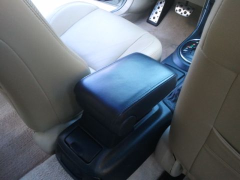 2008 Subaru Legacy - Interior view of a car's center console and seating area, with pedals visible.