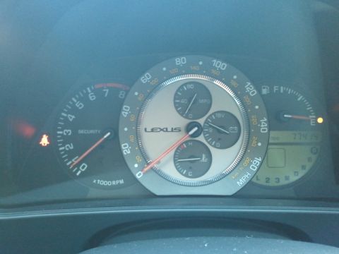 2008 Subaru Legacy - Close-up of a Lexus dashboard showing various gauges including the speedometer, tachometer, and fuel level.