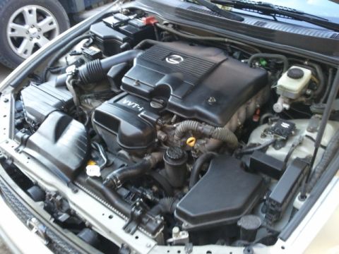 2008 Subaru Legacy - The engine bay of a Lexus IS300, the VVT-i engine cover and various mechanical parts.