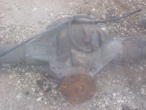 1996 Ford Bronco - This is a close-up view of a vehicle's rear axle assembly, showing brake lines and the differential housing.