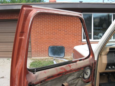 1981 Ford Bronco - The door frame of a vintage vehicle, possibly a 1978 Ford Bronco, is shown with its wing window removed.