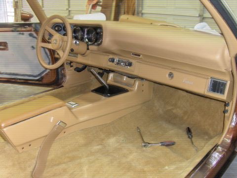 1982 Chevrolet Camaro - The interior of a 1982 Chevrolet Camaro is shown, with tools on the floor suggesting ongoing work.