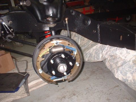 1967 Ford Galaxie - Close-up of a car's brake drum assembly, showing internal components and suspension elements.