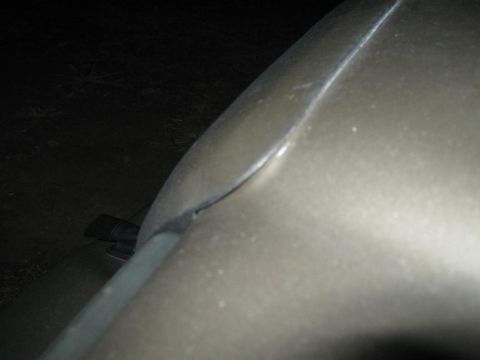 2000 Mercury Grand Marquis - Detail shot of a car's body panel and trim, with a visible watermark.