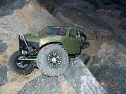 1996 Ford Bronco - This remote control truck is shown navigating a challenging rocky obstacle course.