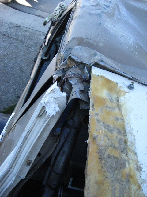 1989 Ford Bronco - Interior damage visible after an incident, showing torn materials and structural elements.