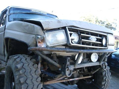 1989 Ford Bronco - This 1989 Ford Bronco features a custom front bumper and lifted suspension, indicating off-road modifications.