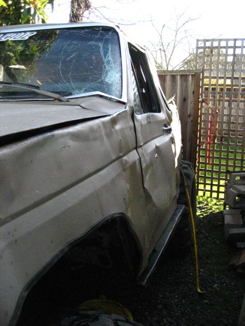 1989 Ford Bronco - This SUV has significant body damage and a shattered windshield, suggesting it has been in an accident.