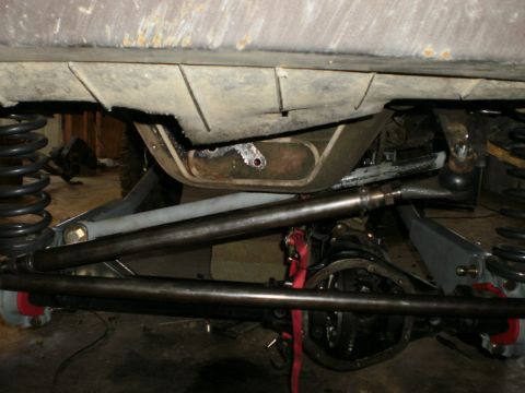 1995 Ford Bronco - Close-up view of the undercarriage and suspension system of a vehicle, with a watermark from Supermotors.net visible.