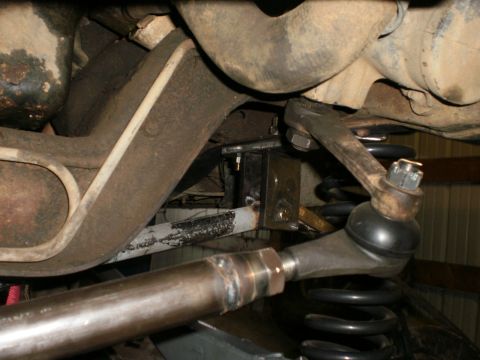 1995 Ford Bronco - Undercarriage view shows suspension parts including springs and steering linkage.