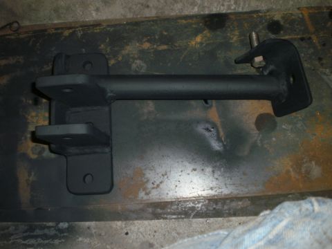 1995 Ford Bronco - A black metal bracket with multiple mounting points is shown.