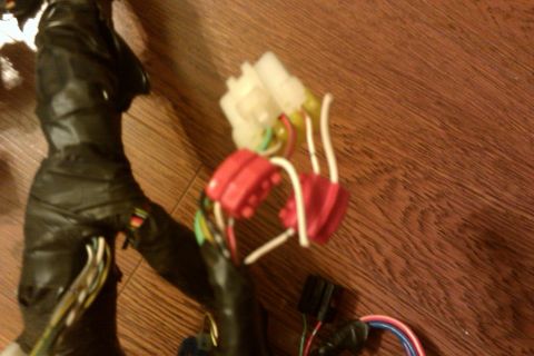 1997 Subaru Legacy - Close-up of an automotive wiring harness with multiple connectors and exposed wires.