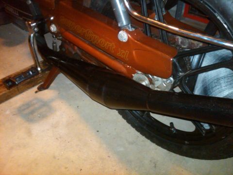 1981 Garelli Rally Sport - The image shows a close-up of a Garelli moped's frame and exhaust system, with visible text indicating 'SuperSport xl'.