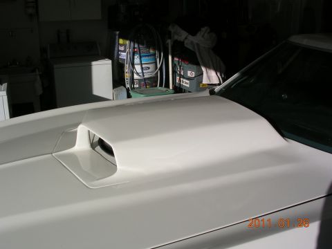1972 Ford Ranchero - A white car hood with a large scoop is shown in a garage setting.
