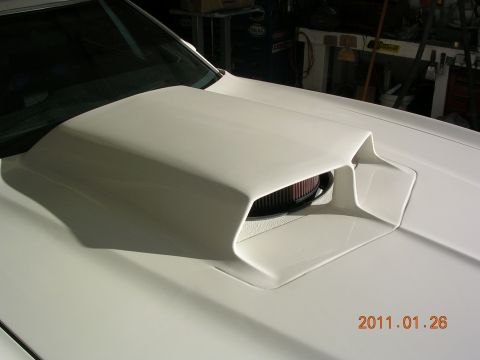 1972 Ford Ranchero - A white hood scoop with an exposed air filter is visible on a vehicle.