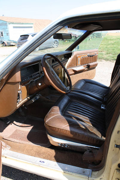1978 Mercury Colony Park - The interior of a 1978 Mercury Colony Park shows its brown vinyl seats and dashboard.