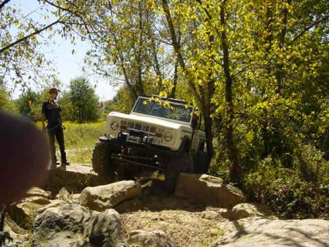 1992 Ford Bronco - A 1978 Ford Bronco is shown tackling a rocky off-road course.