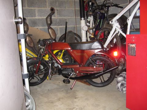 1981 Garelli Rally Sport - A red 1981 Garelli Rally Sport moped is parked in a garage with other vehicles.
