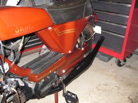 1981 Garelli Rally Sport - Side view of an orange 1981 Garelli Rally Sport moped with a black seat and exhaust.