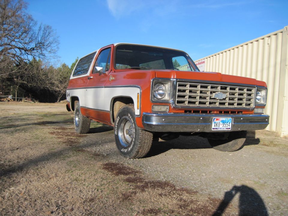 1975 Chevrolet K5 Blazer, orange and white two-tone paint, chrome grille, blue license plate AK8-9554
