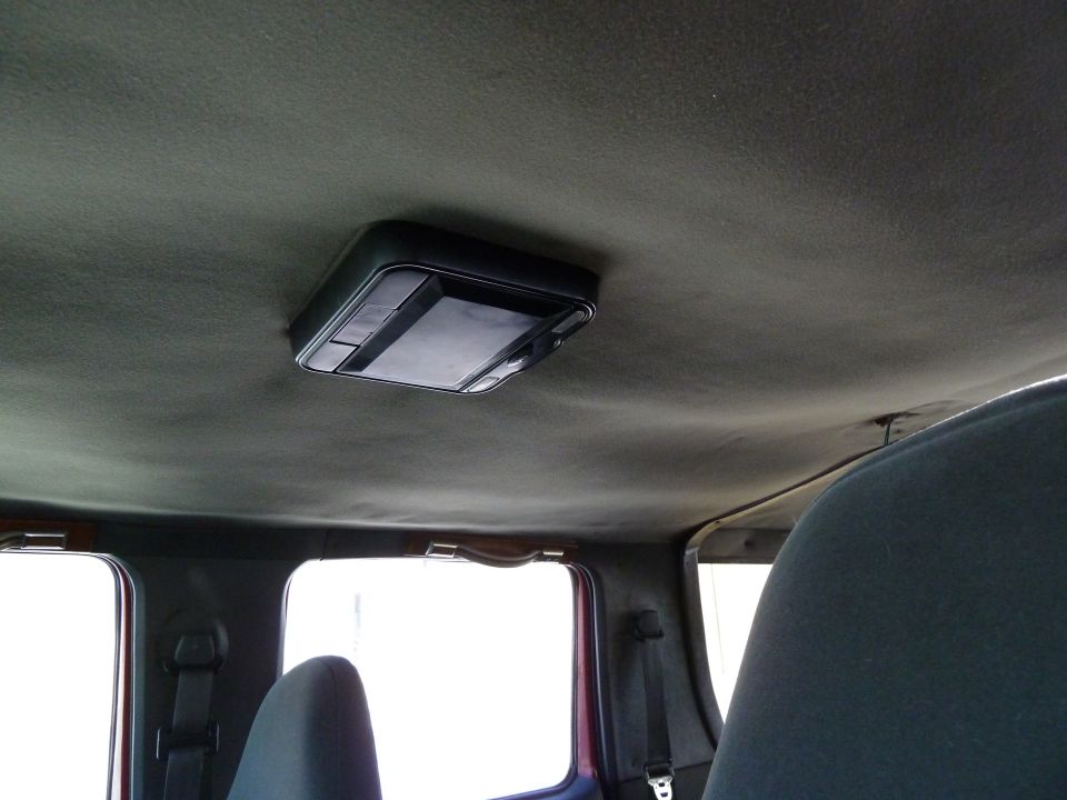 Interior ceiling light console in a vehicle