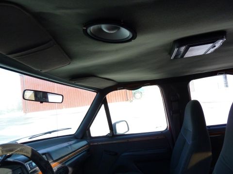 1993 Ford C-150 (Centurion Conversions) - Interior of a 1993 Ford C-150 (Centurion Conversions) showing the headliner, rearview mirror, and dashboard.