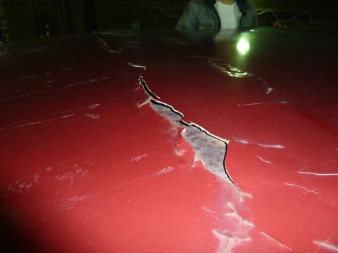 1993 Ford C-150 (Centurion Conversions) - The paint on this vehicle's roof is severely cracked and peeling, revealing rust underneath.