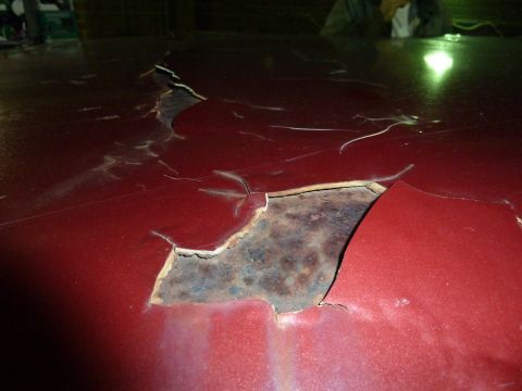 1993 Ford C-150 (Centurion Conversions) - The paint on this car's roof is severely damaged, showing significant rust.