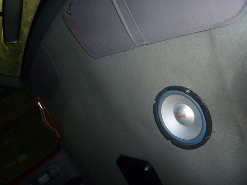 1993 Ford C-150 (Centurion Conversions) - A speaker is installed in the headliner of the vehicle's interior.