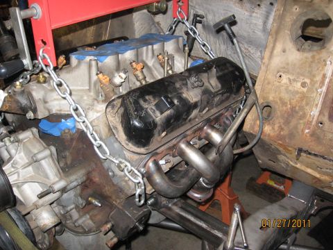 1961 International Scout 800 - Engine installation in progress, with visible fuel injectors and exhaust headers.