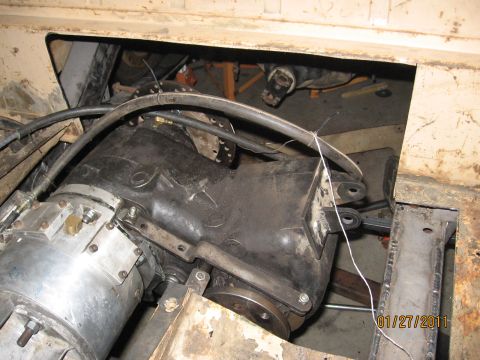 1961 International Scout 800 - The photo shows a close-up of a vehicle's transmission and transfer case assembly, with visible mechanical parts and wiring.