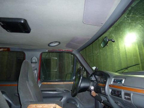 1993 Ford C-150 (Centurion Conversions) - Interior view of a 1993 Ford C-150 (Centurion Conversions) van, highlighting the dashboard and seating.
