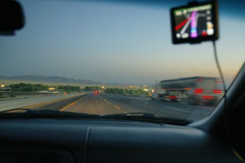 1995 Ford Taurus - Driving on a highway at dusk, with a GPS device mounted on the windshield.