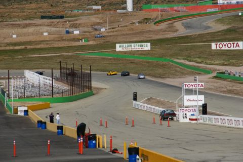 1995 Ford Taurus - Cars race on a track at Willow Springs, with Toyota branding visible on signs.