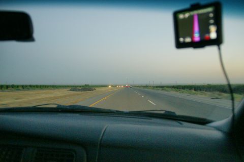 1995 Ford Taurus - Driving on a highway with a GPS navigation system visible on the windshield.