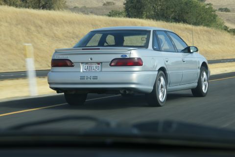 1995 Ford Taurus - Silver 1995 Ford Taurus SHO sedan seen from behind on a highway.