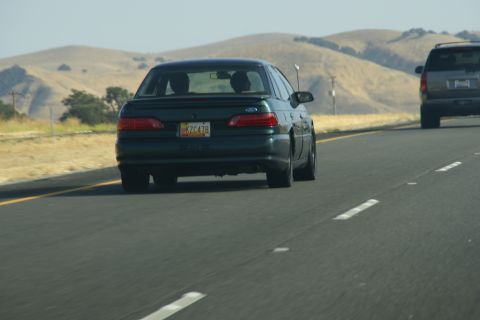 1995 Ford Taurus - Driving on the highway behind a 1995 Ford Taurus with a California license plate.