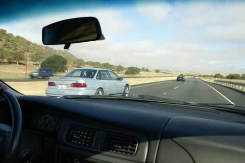 1995 Ford Taurus - Silver 1995 Ford Taurus seen from inside another vehicle on a highway.