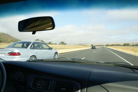 1995 Ford Taurus - Driving on the highway with a 1995 Ford Taurus in the next lane.