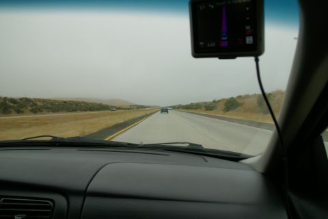 1995 Ford Taurus - Driving on a highway with a GPS device mounted on the windshield.