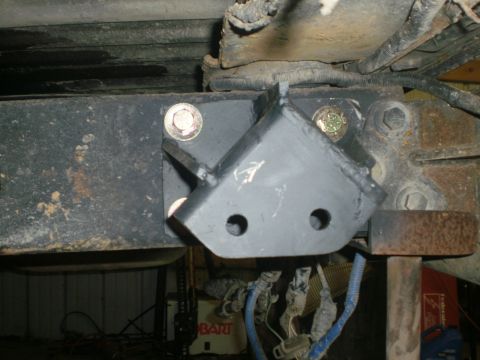1995 Ford Bronco - Custom shackle flip bracket installed on vehicle frame, likely for suspension modification.