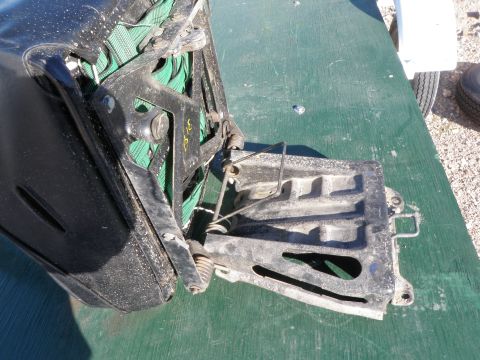 1982 Ford Bronco - The internal mechanism of a vehicle seat is shown, with visible springs and metal components.