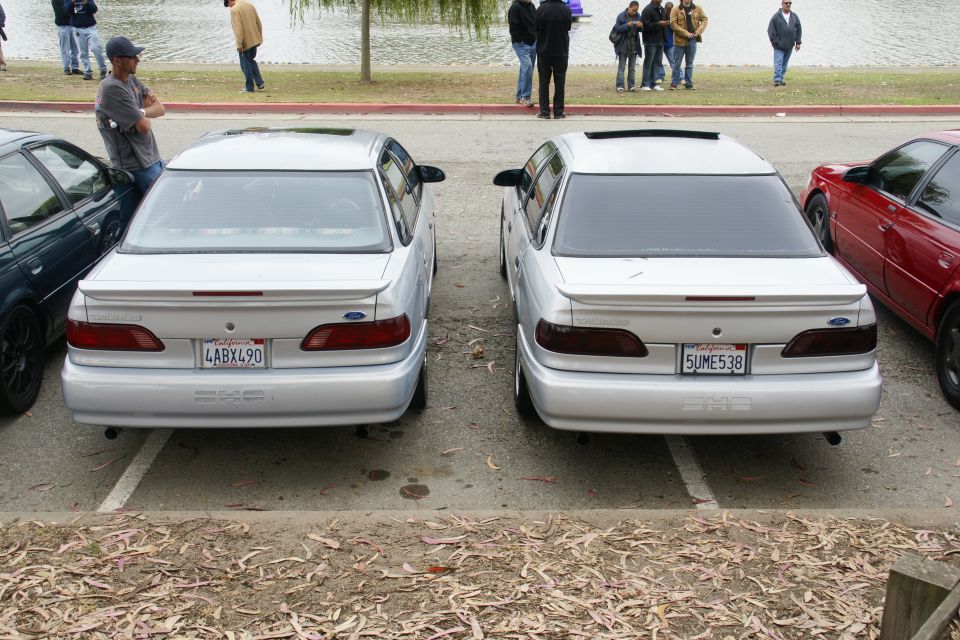 Rear view of two 1995 Ford Taurus sedans parked in tandem