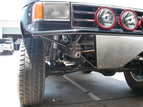1982 Ford Bronco - Modified front end of an SUV, auxiliary lights and custom bumper. The vehicle appears to be from the early 1980s.