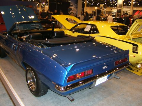 2012 Ford Crown Victoria - Multiple sports cars, including a blue convertible, are parked together at an event.